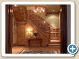 Main floor foyer with grand oak staircase